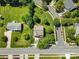 Aerial view of a home featuring a meticulously maintained lawn and mature trees at 21907 Torrence Chapel Rd, Cornelius, NC 28031