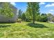 Well-maintained backyard with mature trees offering shade and tranquility, great for outdoor enjoyment at 21907 Torrence Chapel Rd, Cornelius, NC 28031