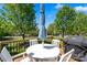 Inviting backyard deck with outdoor seating, a grill, and a charming spot to enjoy a lovely sunny day at 21907 Torrence Chapel Rd, Cornelius, NC 28031
