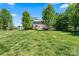 Expansive backyard featuring a lush green lawn, mature trees, and plenty of space for outdoor activities at 21907 Torrence Chapel Rd, Cornelius, NC 28031