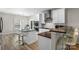 Modern kitchen with white cabinetry, stainless steel appliances, and island with bar seating at 21907 Torrence Chapel Rd, Cornelius, NC 28031