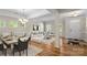 Elegant open-concept living and dining area with hardwood floors and ample natural light at 21907 Torrence Chapel Rd, Cornelius, NC 28031