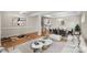 Open-concept living space with elegant furnishings, dining area, and view into the modern kitchen at 21907 Torrence Chapel Rd, Cornelius, NC 28031