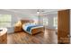 Spacious main bedroom featuring tray ceilings, a ceiling fan, and plenty of natural light at 21907 Torrence Chapel Rd, Cornelius, NC 28031