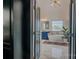Modern bathroom with a soaking tub, blue vanities, and marble flooring at 2380 Fairport Se Dr, Concord, NC 28025