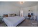 Comfortable bedroom with stylish decor, soft lighting, and a well-appointed desk area at 2380 Fairport Se Dr, Concord, NC 28025