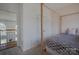 Bedroom view with a four-poster bed and custom trim, providing a view to the staircase at 2380 Fairport Se Dr, Concord, NC 28025