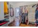 Walk-in closet with custom shelving, hardwood floors, and ample storage space at 2380 Fairport Se Dr, Concord, NC 28025