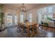 Dining area with rustic wood table and modern light fixture at 2380 Fairport Se Dr, Concord, NC 28025