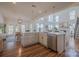 Bright kitchen with island, stainless steel dishwasher, and open floor plan at 2380 Fairport Se Dr, Concord, NC 28025
