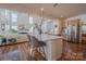 Bright kitchen with island, stainless steel dishwasher, and open floor plan at 2380 Fairport Se Dr, Concord, NC 28025