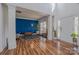 Spacious living area with designer wall, hardwood floors, and plenty of natural light at 2380 Fairport Se Dr, Concord, NC 28025
