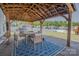 Covered patio with outdoor seating, a grill, and a view of the backyard at 2380 Fairport Se Dr, Concord, NC 28025