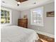 Bright bedroom with hardwood floors, ceiling fan, and natural light at 241 Wakefield Dr # C, Charlotte, NC 28209