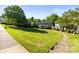 Exterior showing the building's facade with a lush green lawn and trees at 241 Wakefield Dr # C, Charlotte, NC 28209