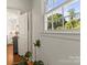 Hallway view of a bright kitchen and outside window at 241 Wakefield Dr # C, Charlotte, NC 28209