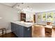 Stylish kitchen island that opens to a cozy living room with hardwood floors at 241 Wakefield Dr # C, Charlotte, NC 28209