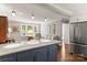 Modern kitchen with a white countertop island and a connecting living room at 241 Wakefield Dr # C, Charlotte, NC 28209