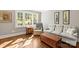 Cozy living room featuring hardwood floors, neutral color scheme, and ample natural light at 241 Wakefield Dr # C, Charlotte, NC 28209