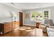 Inviting living room with hardwood floors, natural light, and comfortable seating at 241 Wakefield Dr # C, Charlotte, NC 28209