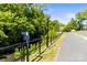 Scenic walking path alongside lush greenery and a creek, perfect for enjoying nature's beauty at 241 Wakefield Dr # C, Charlotte, NC 28209
