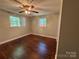 Bedroom with hardwood floors, and two windows providing lots of natural light at 2703 34Th Street Ne Pl, Hickory, NC 28601