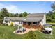 Aerial view of backyard featuring a covered deck, hot tub gazebo, and lawn at 3008 Gantt St, Salisbury, NC 28146