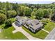 Aerial view of house with a large driveway, big yard, surrounded by trees, offering space, and privacy at 3008 Gantt St, Salisbury, NC 28146