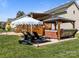 Landscaped backyard features a covered deck, gazebo with hot tub, and lounge seating at 3008 Gantt St, Salisbury, NC 28146