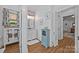 Bathroom with a stylish vanity, patterned wallpaper, and an open doorway leading to another room at 3008 Gantt St, Salisbury, NC 28146