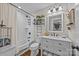 Updated bathroom with subway tiled shower and white vanity offering storage and counterspace at 3008 Gantt St, Salisbury, NC 28146