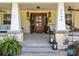 Inviting front entrance with stone pillars, plants, and stylish lighting fixtures at 3008 Gantt St, Salisbury, NC 28146
