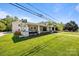 Well-maintained home featuring a large front yard and cozy covered porch at 3008 Gantt St, Salisbury, NC 28146