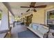 Relaxing covered front porch with comfortable seating, ceiling fans, and stylish decor at 3008 Gantt St, Salisbury, NC 28146
