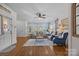 Cozy living room with neutral furniture, a ceiling fan, and bright windows providing natural light at 3008 Gantt St, Salisbury, NC 28146