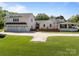 Exterior view of home with a 3 car garage and spacious driveway at 3008 Gantt St, Salisbury, NC 28146