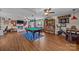 Large recreation room features a pool table, an exercise area, a comfortable seating area and luxury vinyl floors at 3008 Gantt St, Salisbury, NC 28146