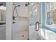 Detailed view of a glass-enclosed shower with white subway tiles and modern fixtures in a stylish bathroom at 3008 Gantt St, Salisbury, NC 28146