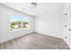 Bedroom with a large window providing natural light and wood-look flooring at 3048 Goble St, Gastonia, NC 28056
