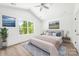 Bright bedroom with a large window, light wood floors, and neutral-toned decor at 3048 Goble St, Gastonia, NC 28056