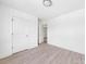 Bedroom featuring wood-look flooring and a view to an open door and closet at 3048 Goble St, Gastonia, NC 28056