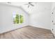Bedroom with a large window, ceiling fan and wood-look flooring at 3048 Goble St, Gastonia, NC 28056