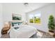 Serene bedroom featuring natural light, neutral decor, and wood-look flooring at 3048 Goble St, Gastonia, NC 28056