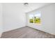 Bedroom with a large window providing natural light and wood-look flooring at 3048 Goble St, Gastonia, NC 28056
