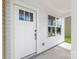 Close-up of the front door entrance with sidelight windows and modern design at 3048 Goble St, Gastonia, NC 28056