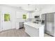 Bright kitchen features stainless appliances, white cabinets, an island, and natural light at 3048 Goble St, Gastonia, NC 28056