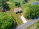An aerial view of a single-story house with a long driveway and a lush green lawn at 3121 Suffolk Dr, Shelby, NC 28152