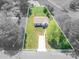 Charming home boasts a spacious lawn, complemented by verdant trees and a lengthy driveway at 3121 Suffolk Dr, Shelby, NC 28152
