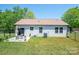 Backyard with patio seating, fenced yard, and central air at 3121 Suffolk Dr, Shelby, NC 28152