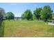 Expansive fenced backyard with mature trees, offering a private and serene outdoor space at 3121 Suffolk Dr, Shelby, NC 28152
